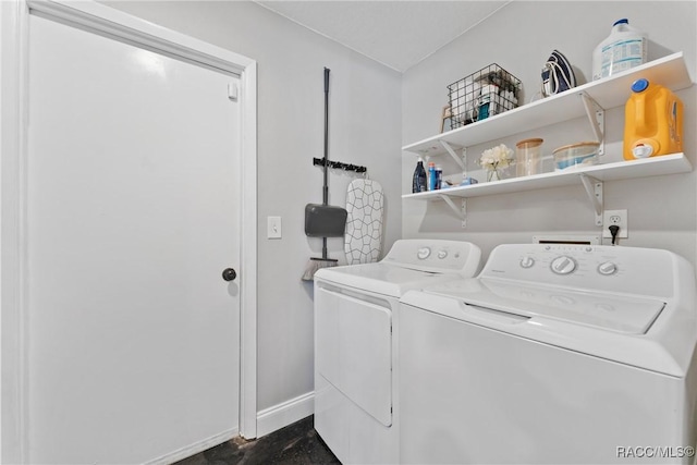 8638 Chadwick Dr, Tampa, FL 33635 - laundry room with washer and dryer and baseboards