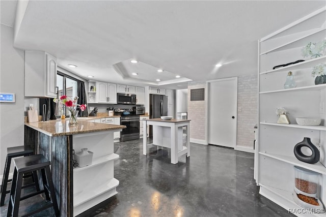 8638 Chadwick Dr, Tampa, FL 33635 - kitchen with open shelves, appliances with stainless steel finishes, baseboards, white cabinetry, and a breakfast bar