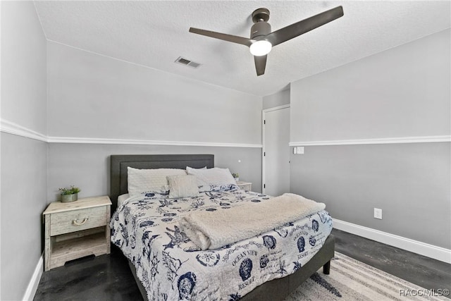 8638 Chadwick Dr, Tampa, FL 33635 - bedroom featuring baseboards, ceiling fan, concrete floors, and a textured ceiling