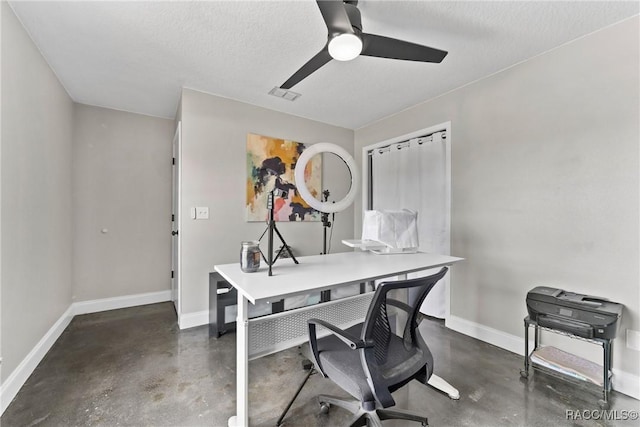 8638 Chadwick Dr, Tampa, FL 33635 - office area featuring finished concrete flooring, baseboards, ceiling fan, and a textured ceiling
