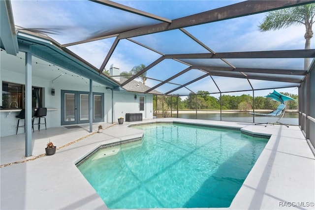 8638 Chadwick Dr, Tampa, FL 33635 - swimming pool with french doors, a patio, and glass enclosure
