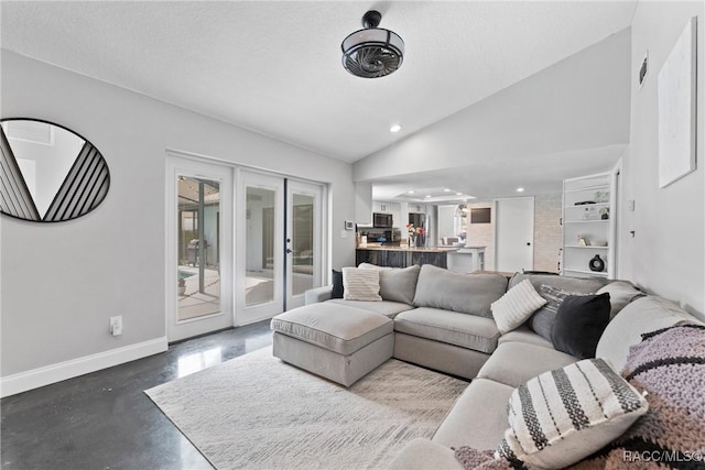8638 Chadwick Dr, Tampa, FL 33635 - living area featuring baseboards, french doors, concrete flooring, vaulted ceiling, and recessed lighting