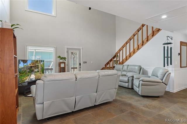 living room with a towering ceiling