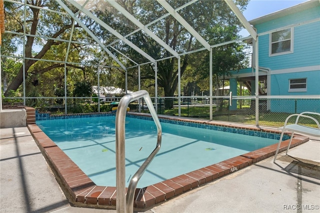 view of pool featuring a patio and a lanai