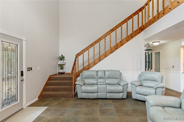 living room featuring a towering ceiling