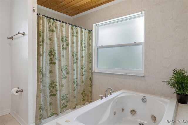 bathroom with wood ceiling, ornamental molding, and a tub