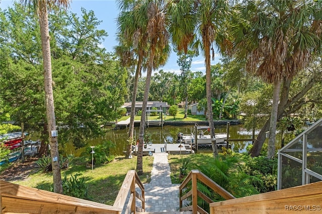 view of dock featuring a water view and glass enclosure