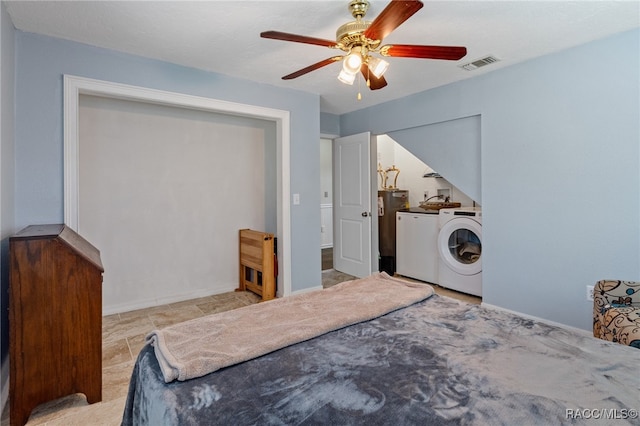 bedroom with ceiling fan and washing machine and clothes dryer