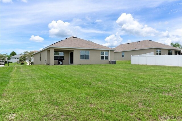 3417 N Michener Pt Unit 2C, Beverly Hills, FL 34465 - rear view of house with stucco siding