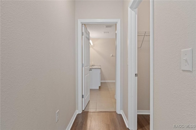 3417 N Michener Pt Unit 2C, Beverly Hills, FL 34465 - hallway featuring wood finished floors and a textured wall