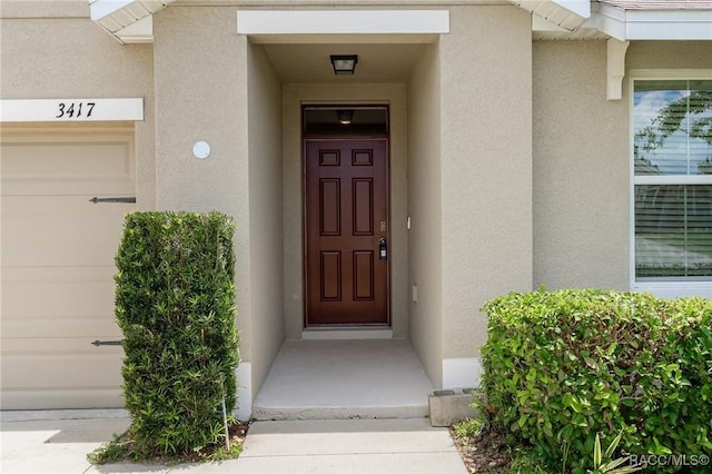 3417 N Michener Pt Unit 2C, Beverly Hills, FL 34465 - property entrance with stucco siding and a garage