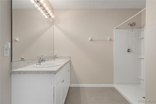 3417 N Michener Pt Unit 2C, Beverly Hills, FL 34465 - full bathroom with tile patterned floors, double vanity, and a shower