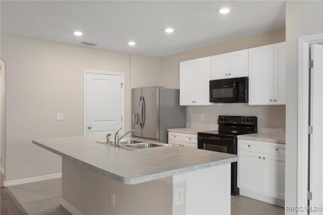 3417 N Michener Pt Unit 2C, Beverly Hills, FL 34465 - kitchen featuring black appliances, an island with sink, white cabinetry, light countertops, and recessed lighting