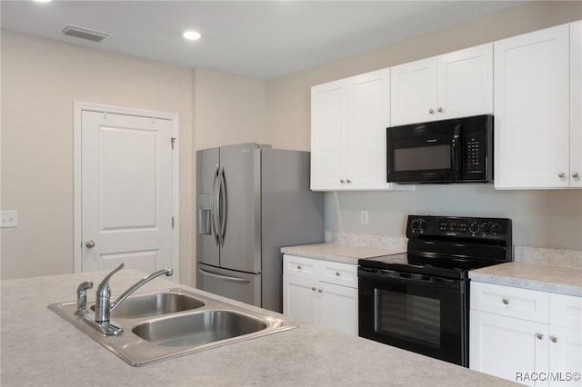 3417 N Michener Pt Unit 2C, Beverly Hills, FL 34465 - kitchen featuring black appliances, white cabinetry, light countertops, and recessed lighting
