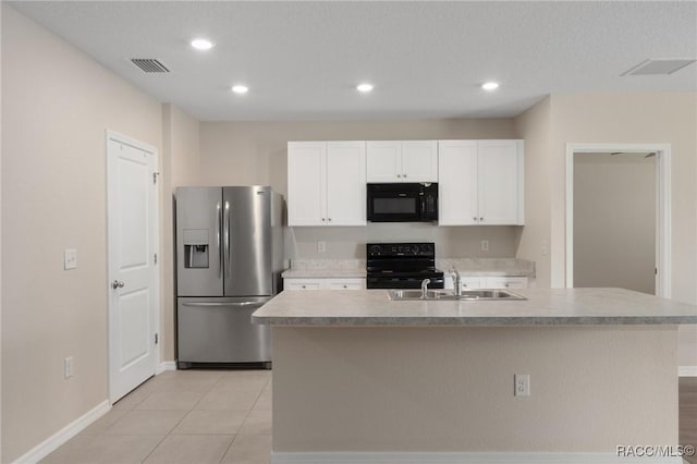 3417 N Michener Pt Unit 2C, Beverly Hills, FL 34465 - kitchen featuring black appliances, white cabinets, recessed lighting, light countertops, and an island with sink