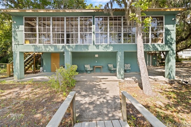 rear view of house featuring a patio