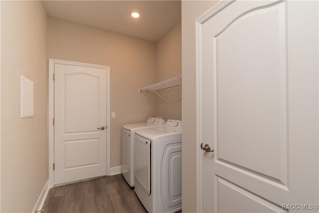 laundry area with laundry area, dark wood-style flooring, baseboards, recessed lighting, and washer and dryer