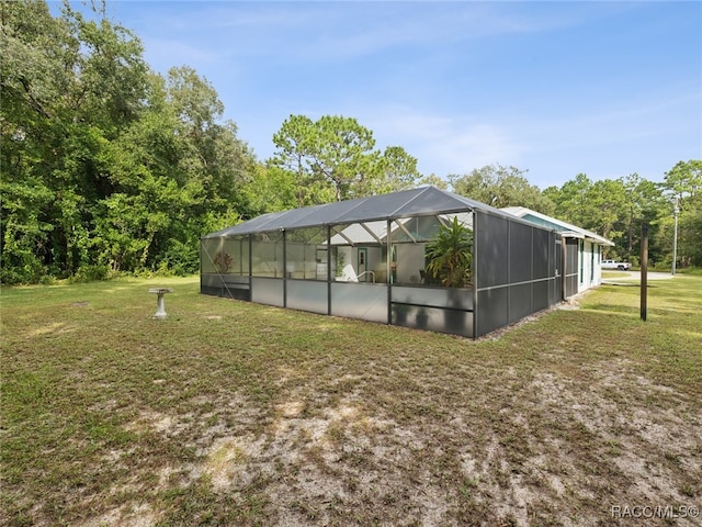 view of yard featuring glass enclosure