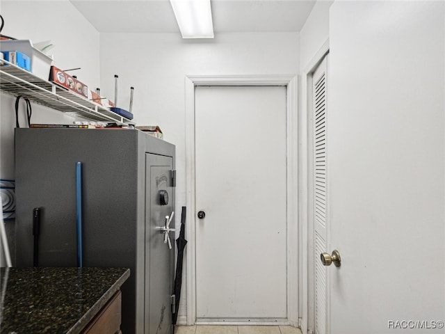 interior space featuring dark stone counters