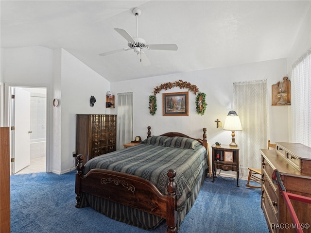 bedroom with carpet floors, ensuite bath, vaulted ceiling, and ceiling fan