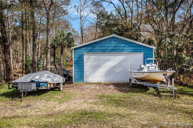 garage with a lawn