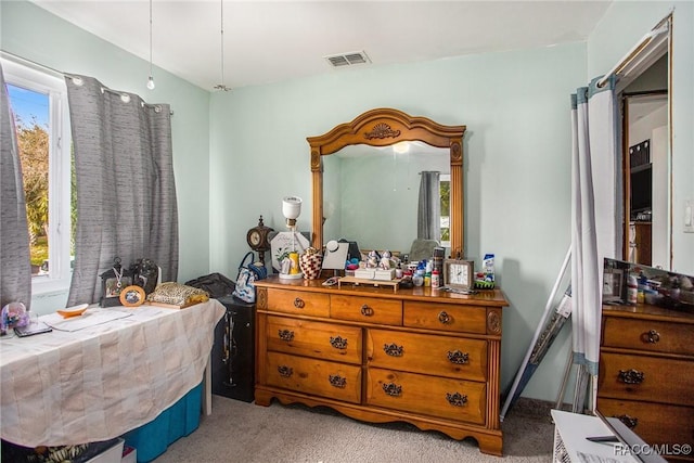 bedroom with light carpet