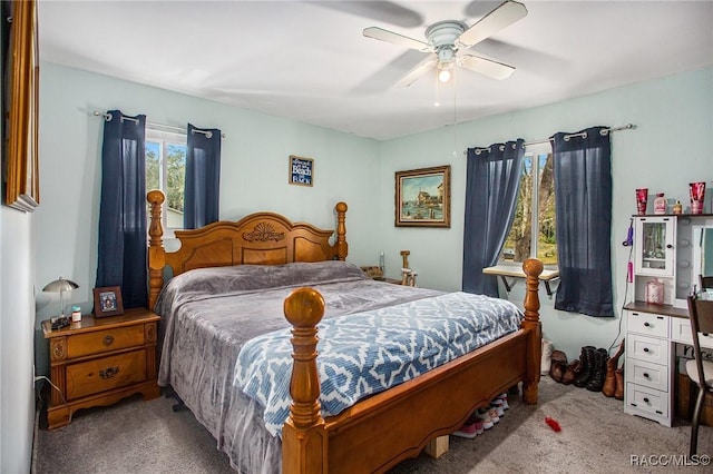 bedroom featuring light colored carpet and ceiling fan