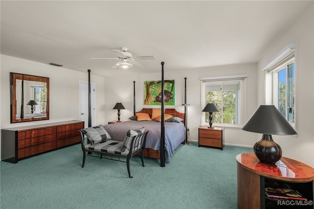 carpeted bedroom featuring ceiling fan and visible vents