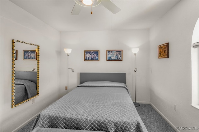 carpeted bedroom with baseboards and ceiling fan