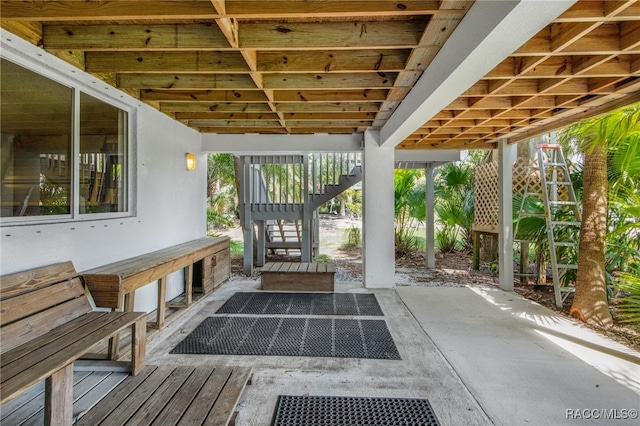 view of patio featuring stairway
