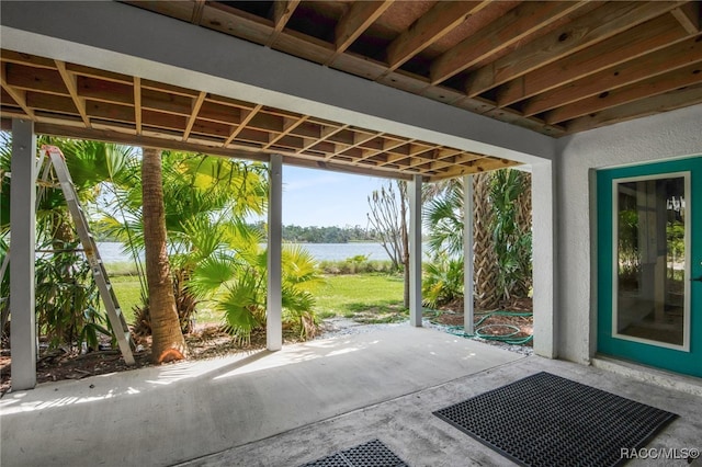 view of patio with a water view