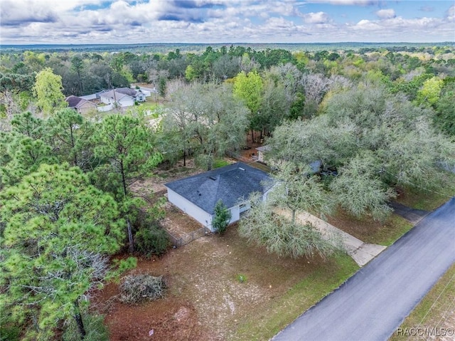 bird's eye view featuring a forest view