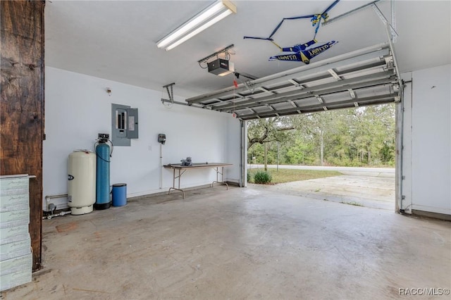 garage featuring electric panel and a garage door opener