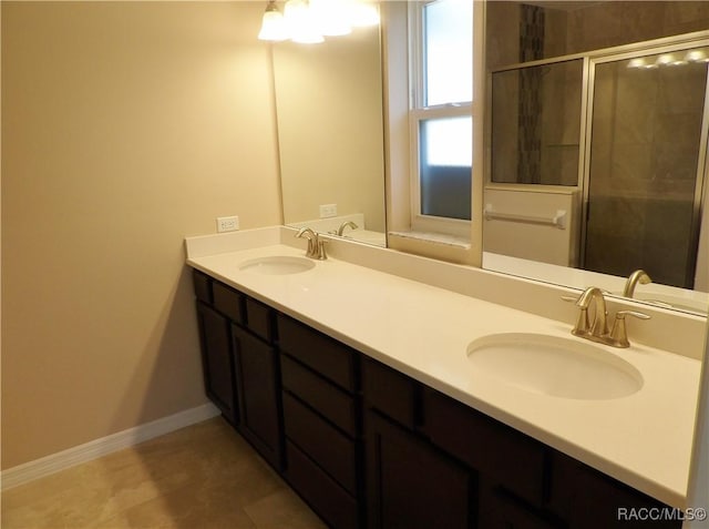 bathroom featuring vanity and an enclosed shower