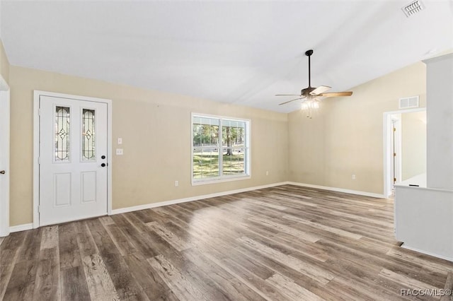 entrance foyer with hardwood / wood-style floors, vaulted ceiling, and ceiling fan