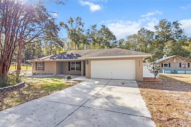 single story home featuring a garage