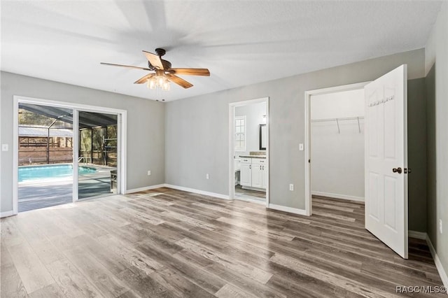 unfurnished living room with hardwood / wood-style floors and ceiling fan