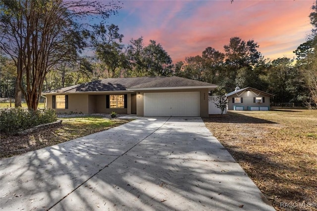 single story home with a garage