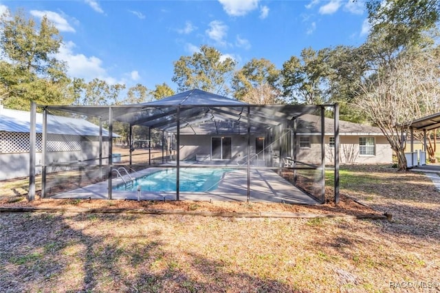 view of pool featuring a lanai and a patio area