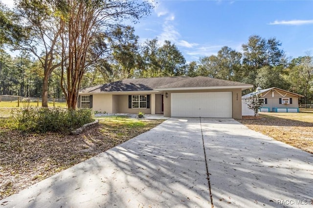 single story home featuring a garage