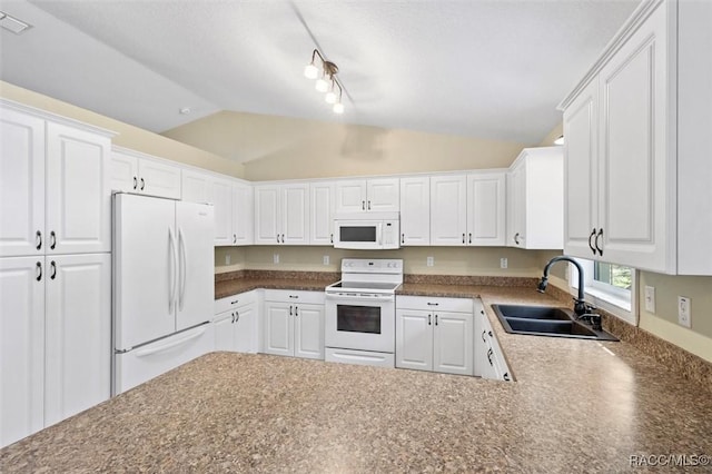 kitchen with vaulted ceiling, white cabinetry, sink, kitchen peninsula, and white appliances