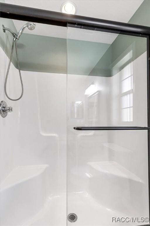 bathroom featuring walk in shower