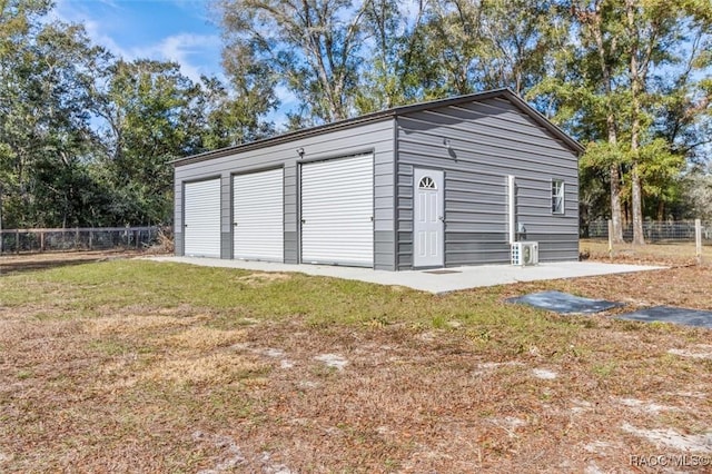 garage featuring a yard