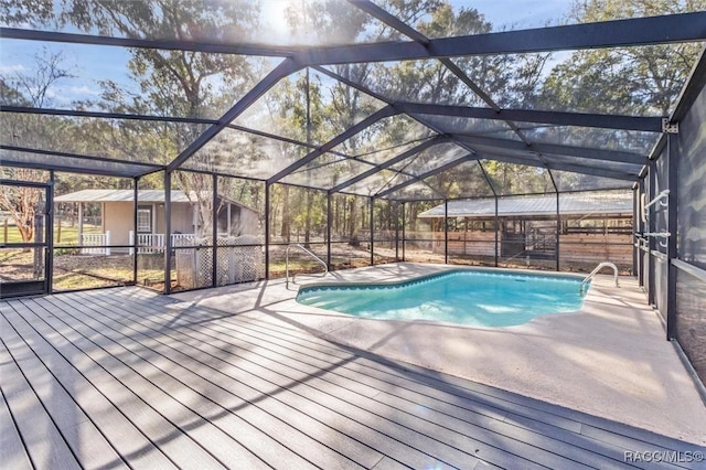 view of swimming pool with a lanai