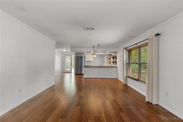 kitchen with a tray ceiling, sink, backsplash, and dishwasher