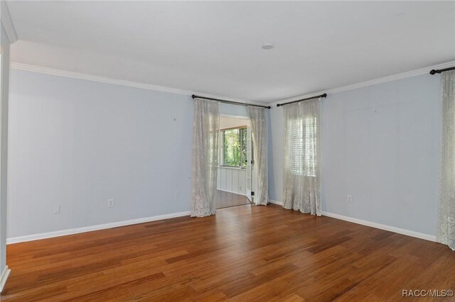 unfurnished room featuring dark hardwood / wood-style floors