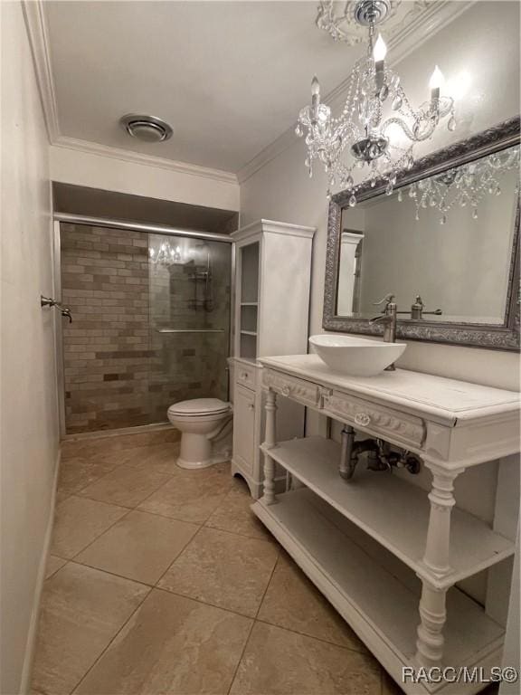 bathroom featuring a shower with shower door, sink, tile patterned flooring, ornamental molding, and toilet