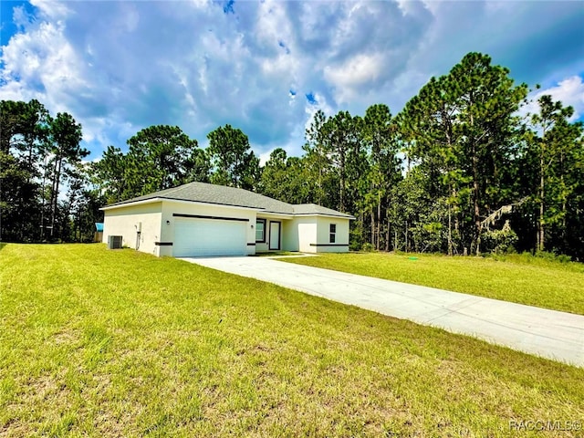 single story home featuring a front yard, a garage, and central AC unit