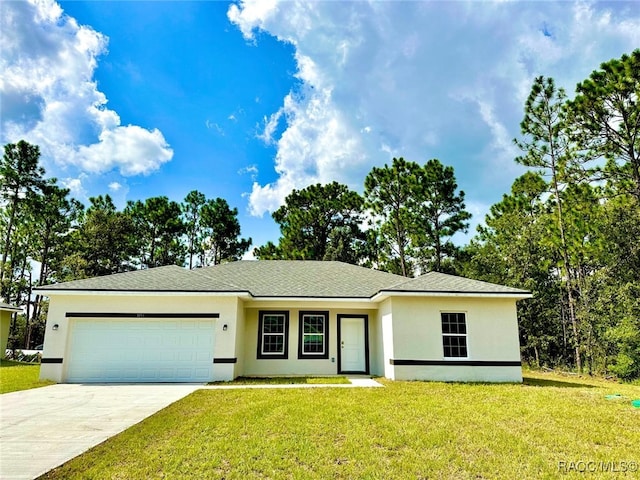 single story home featuring a front lawn and a garage