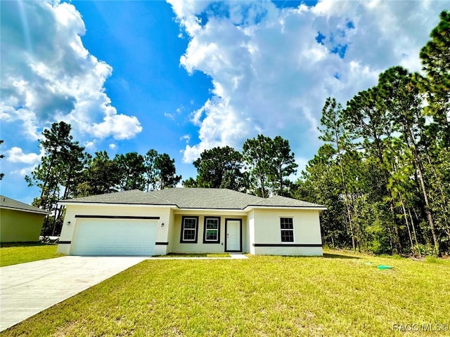 view of front facade with a front yard and a garage